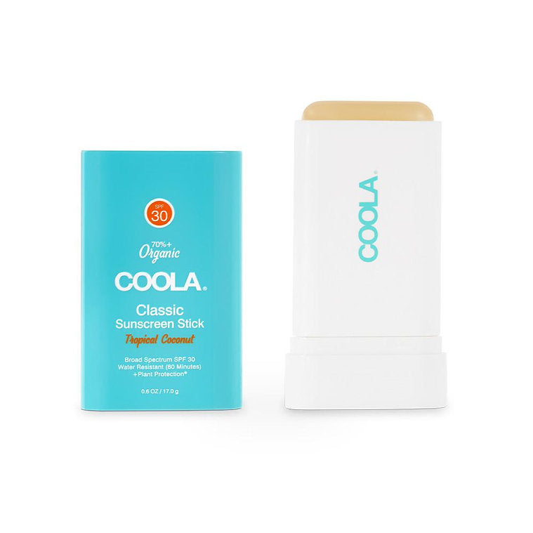Classic Organic Sunscreen Stick SPF 30 with Tropical Coconut scent by COOLA, shown in a blue container next to the open stick.