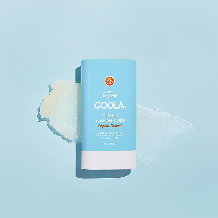 Classic Organic Sunscreen Stick SPF 30 in Tropical Coconut scent on a light blue background.