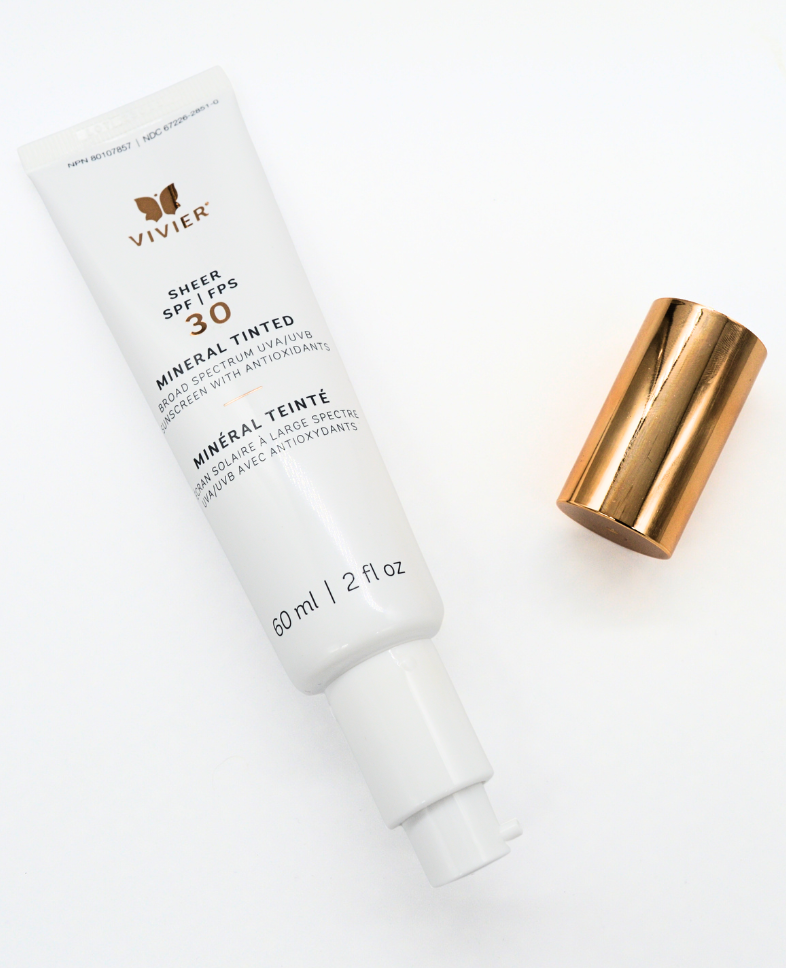 Vivier SHEER SPF 30 Mineral Tinted sunscreen tube with cap, offering UVA and UVB protection and skin tone-adjusting ChromaTint™.