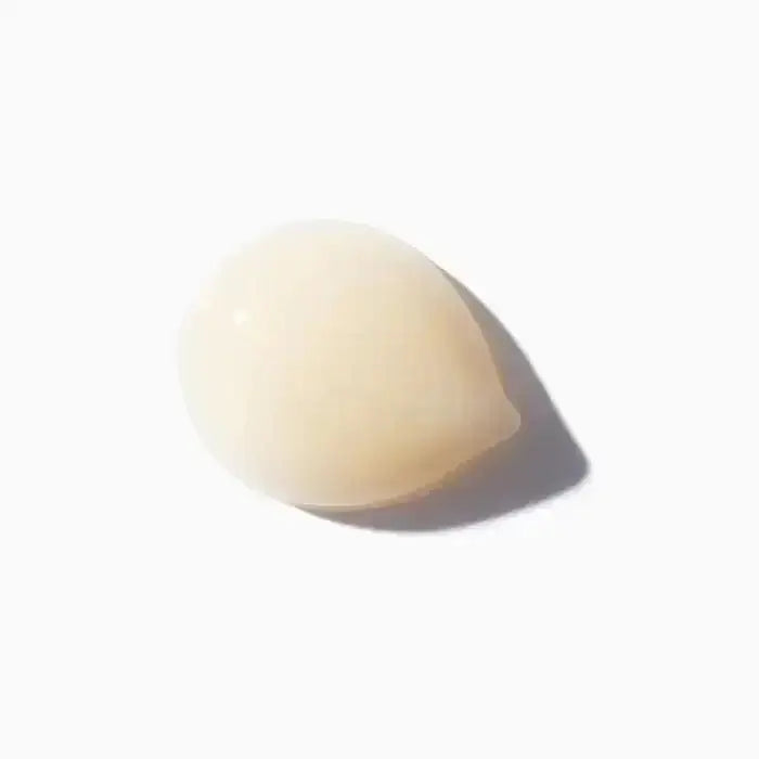 Texture of Kérastase 8H Magic Night Serum for dry hair care, highlighting its light, non-greasy formula with essential nutrients.