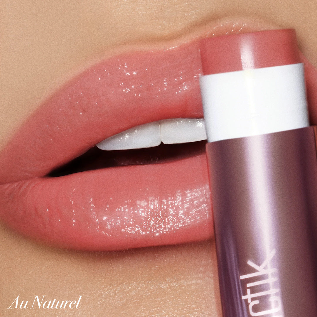 Close-up of lips wearing Girlactik Jello Gloss Balm in Au Naturel shade, with a glossy, hydrating finish and pink lemonade scent.
