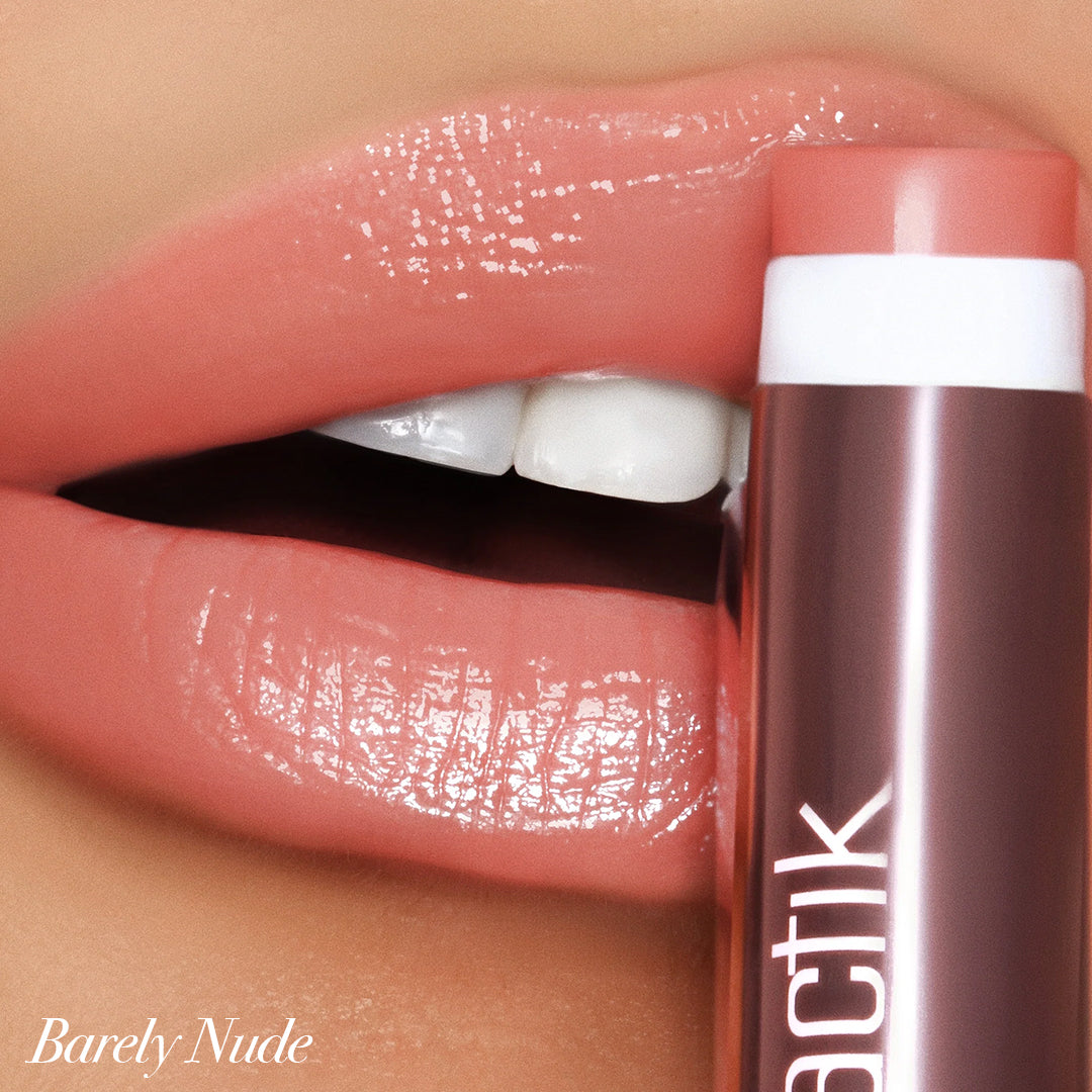 Close-up of lips wearing Girlactik Jello Gloss Balm in Barely Nude, showcasing a glossy finish and moisturizing formula.