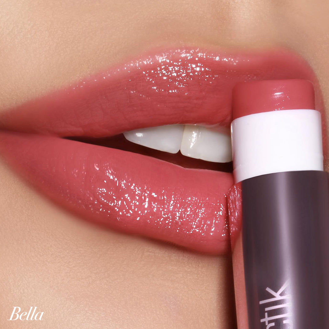 Close-up of lips applying Girlactik Jello Gloss Balm in Bella shade, showcasing a glossy, pink lemonade-scented finish.
