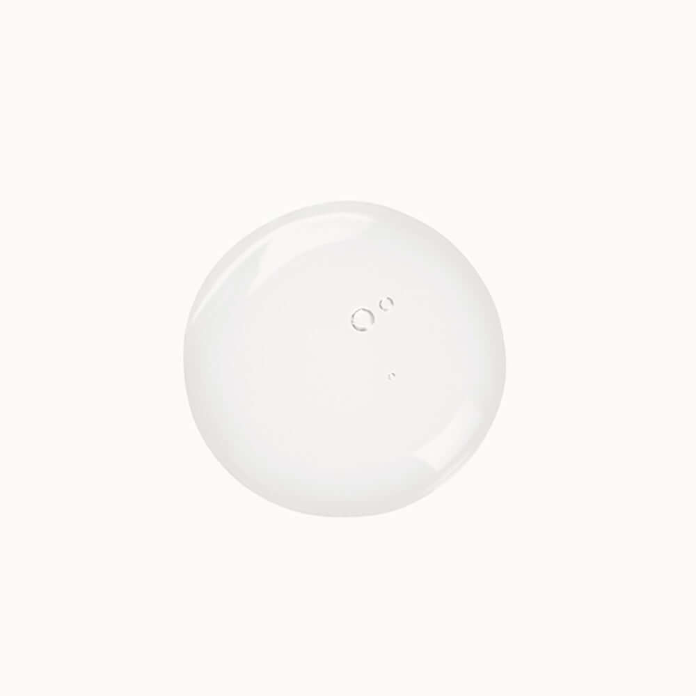Clear liquid droplet representing the texture of the Eye and Lip Make-Up Remover with aloe extracts.