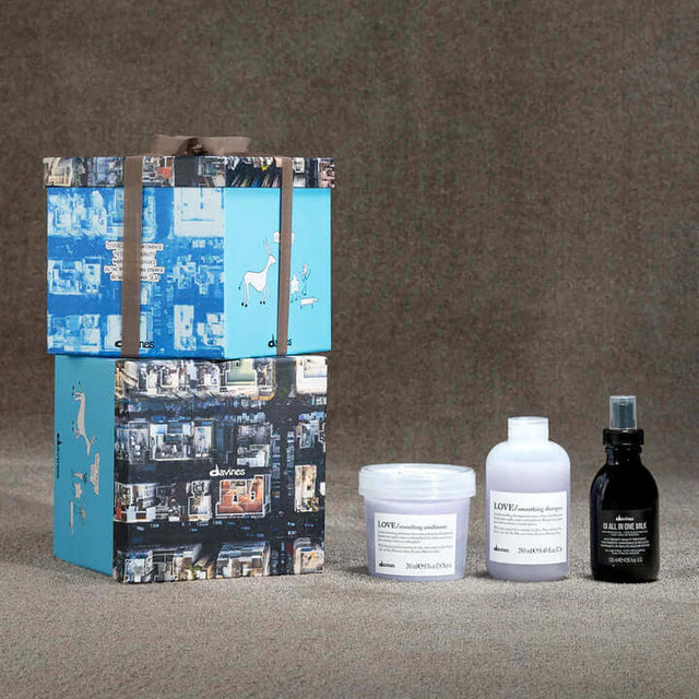 Love Smoothing Oi Gift Set by Davines with shampoo, conditioner, and all-in-one milk for frizz control and smoothness.
