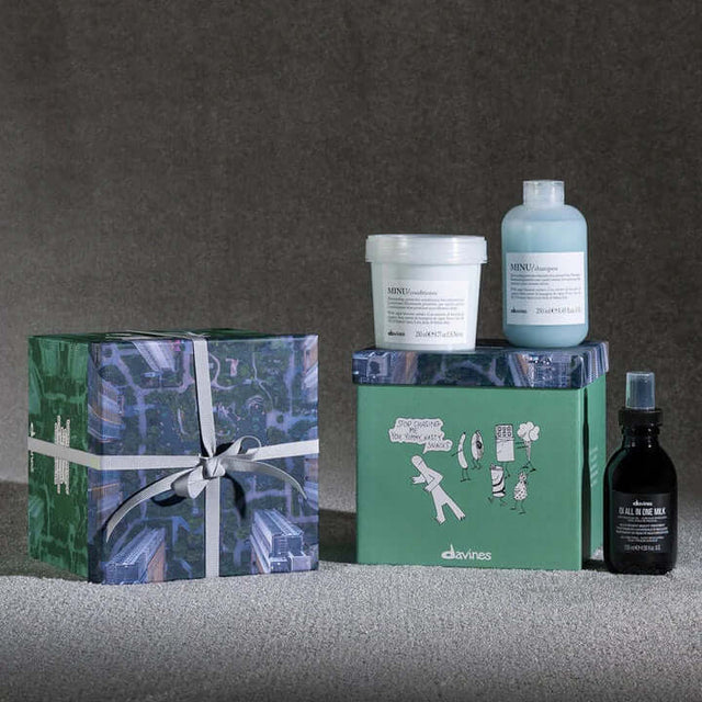Davines Minu Oi Gift Set with Minu Shampoo, Conditioner, and OI All-in-One Milk for vibrant colored hair, includes decorative box.