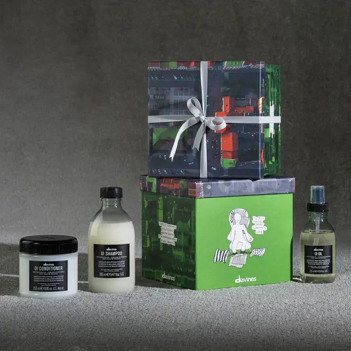 Davines OI Traditional Gift Set with Shampoo, Conditioner, and Oil for shiny and protected hair, packaged elegantly.