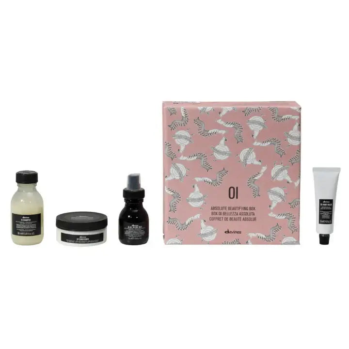 Davines Oi Travel Gift Set with shampoo, conditioner, all-in-one milk, and hand balm for convenient hair care and skin hydration.