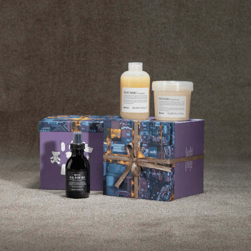 Davines Nounou Gift Set with shampoo, conditioner, and OI All-in-One Milk for nourishing and repairing dry, damaged hair.