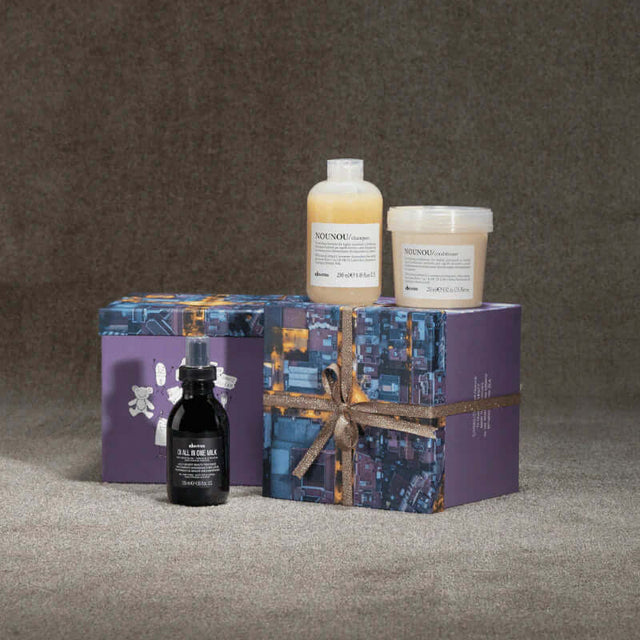 Davines Nounou Gift Set with shampoo, conditioner, and OI All-in-One Milk for nourishing and repairing dry, damaged hair.