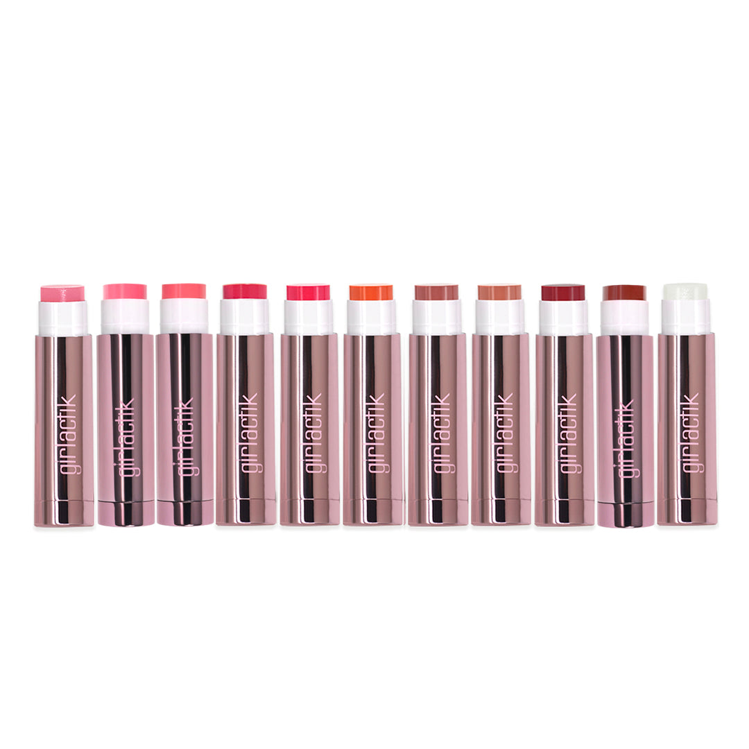 Collection of Girlactik Jello Gloss Balm lip colors in sleek packaging, featuring a variety of pink and nude shades for a glossy finish.
