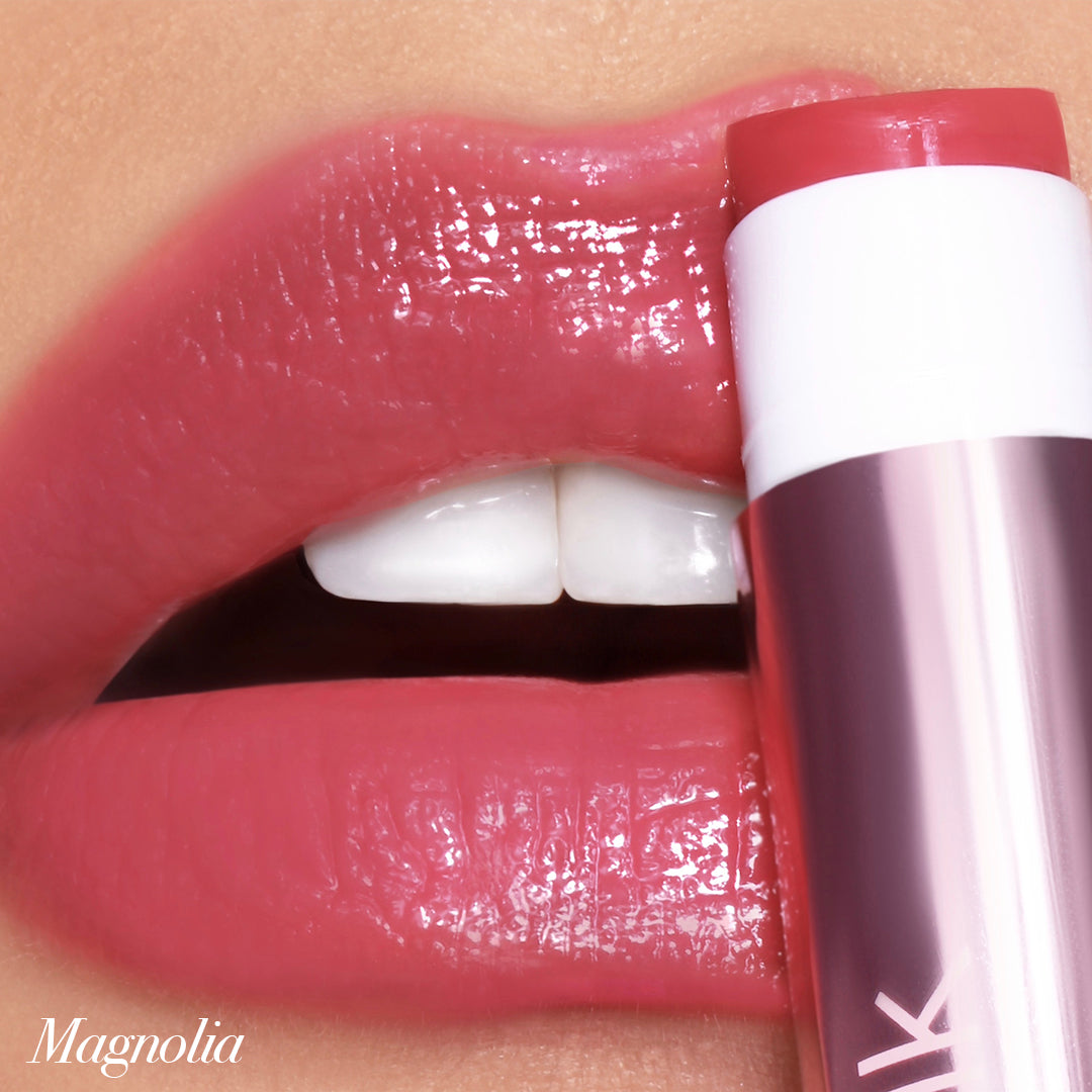Close-up of lips with Jello Gloss Balm in Magnolia, featuring a glossy, non-sticky finish and pink lemonade scent.