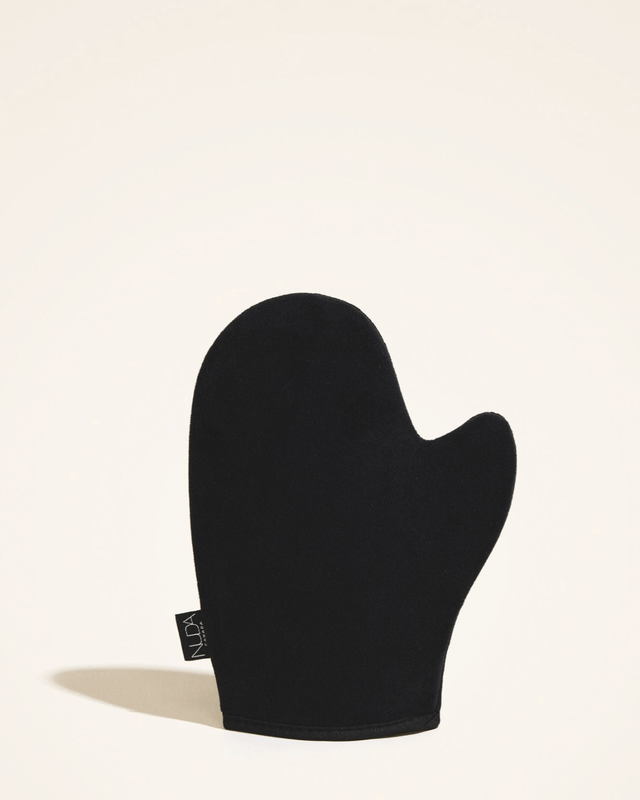 Black velvet tanning mitt for smooth, streak-free self tanning application, reusable and washable for a flawless finish.