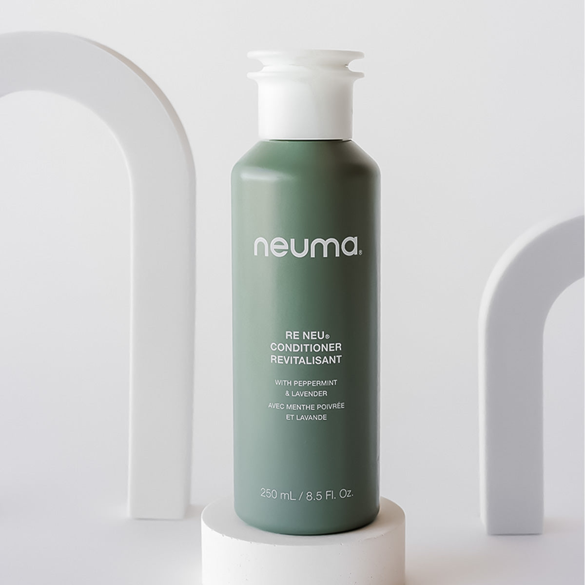 Re Neu Conditioner bottle with peppermint and vanilla aroma, nourishes and enhances hair shine, suitable for all hair types.