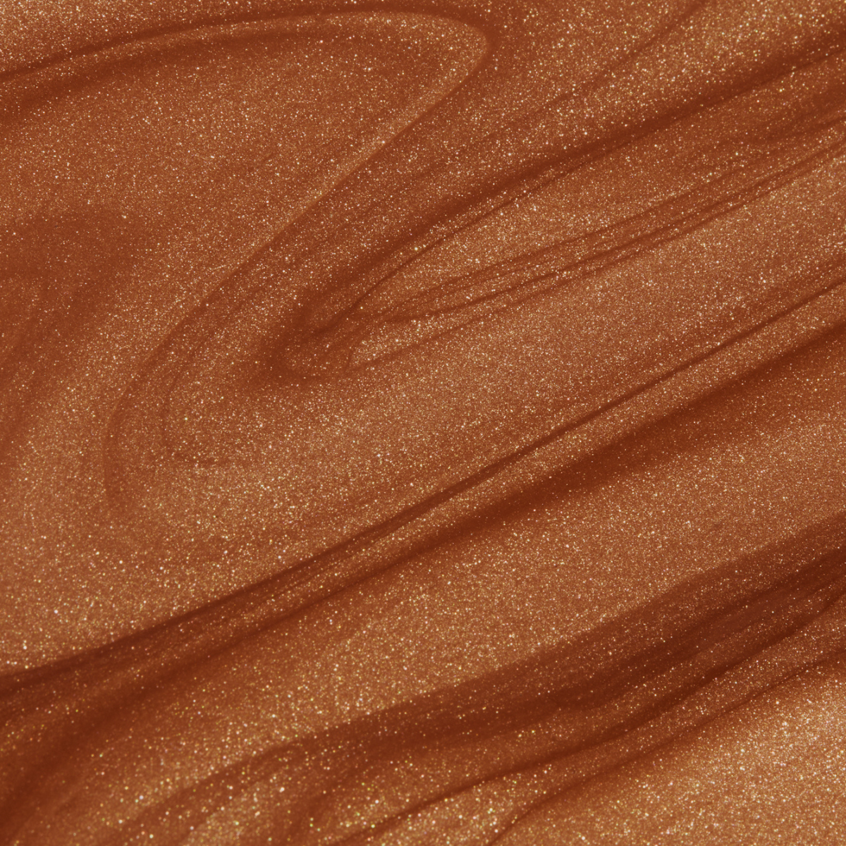Rich bronze liquid texture of Nuda's Bronzing Glow Drops, showcasing a shimmering, sun-kissed finish for radiant, glowing skin.