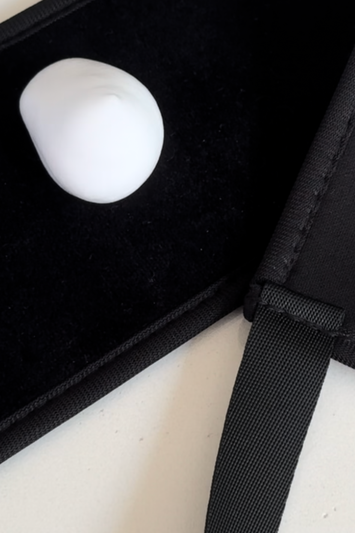 Self Tan Back Applicator with foam for even tanning coverage on difficult-to-reach spots, laid out on a black surface.