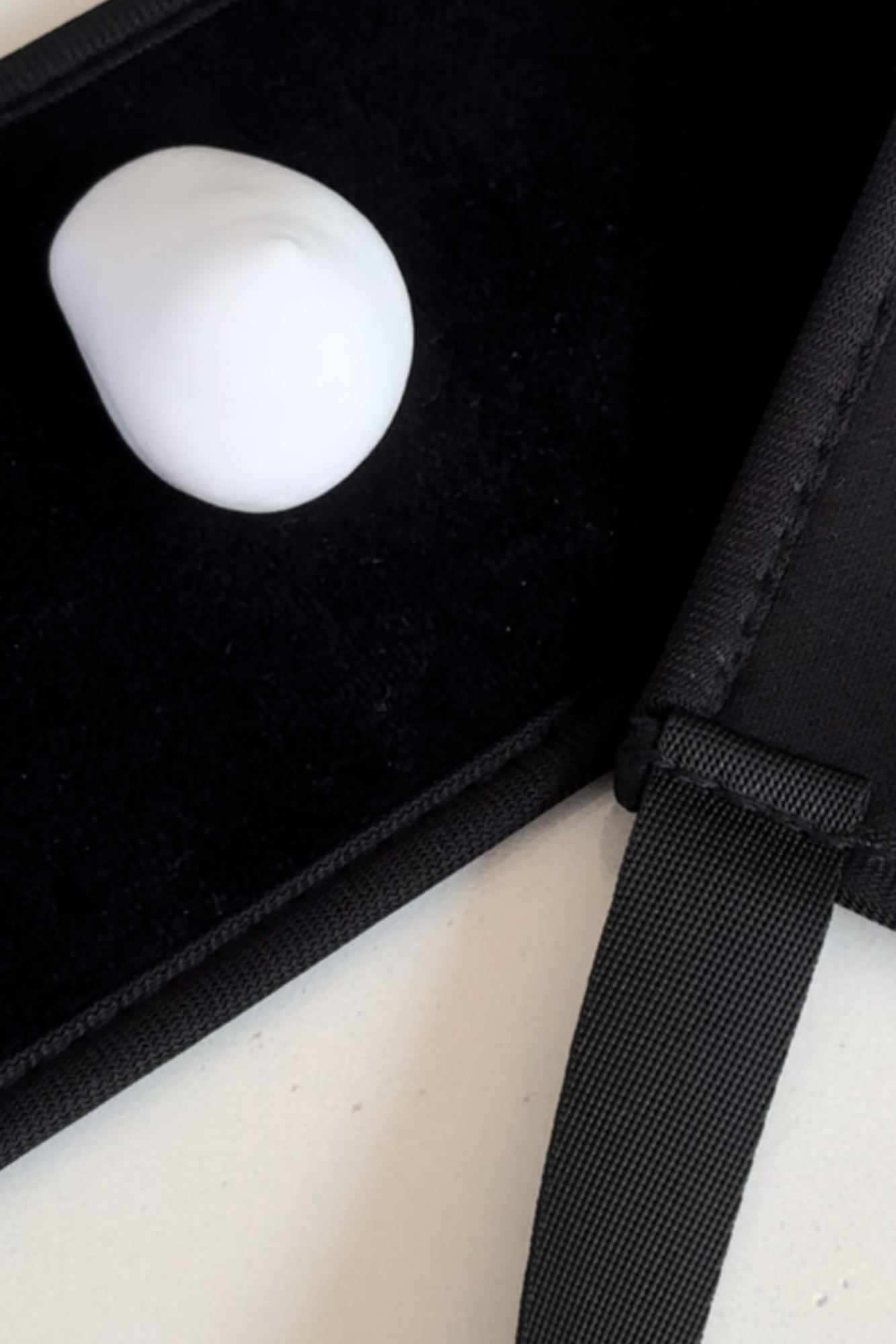 Self Tan Back Applicator with foam for even tanning coverage on difficult-to-reach spots, laid out on a black surface.