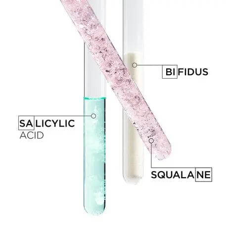 Test tubes with salicylic acid, bifidus, and squalane, highlighting Kerastase ingredients for soothing scalp and hydrating hair care.