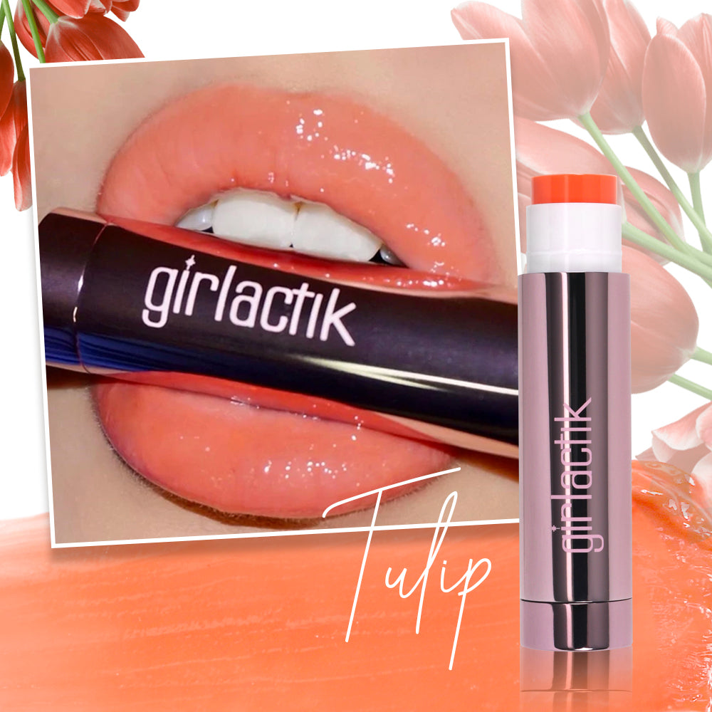Girlactik Jello Gloss Balm in Tulip shade featuring glossy lips with nourishing ingredients for hydration and a pink lemonade scent.
