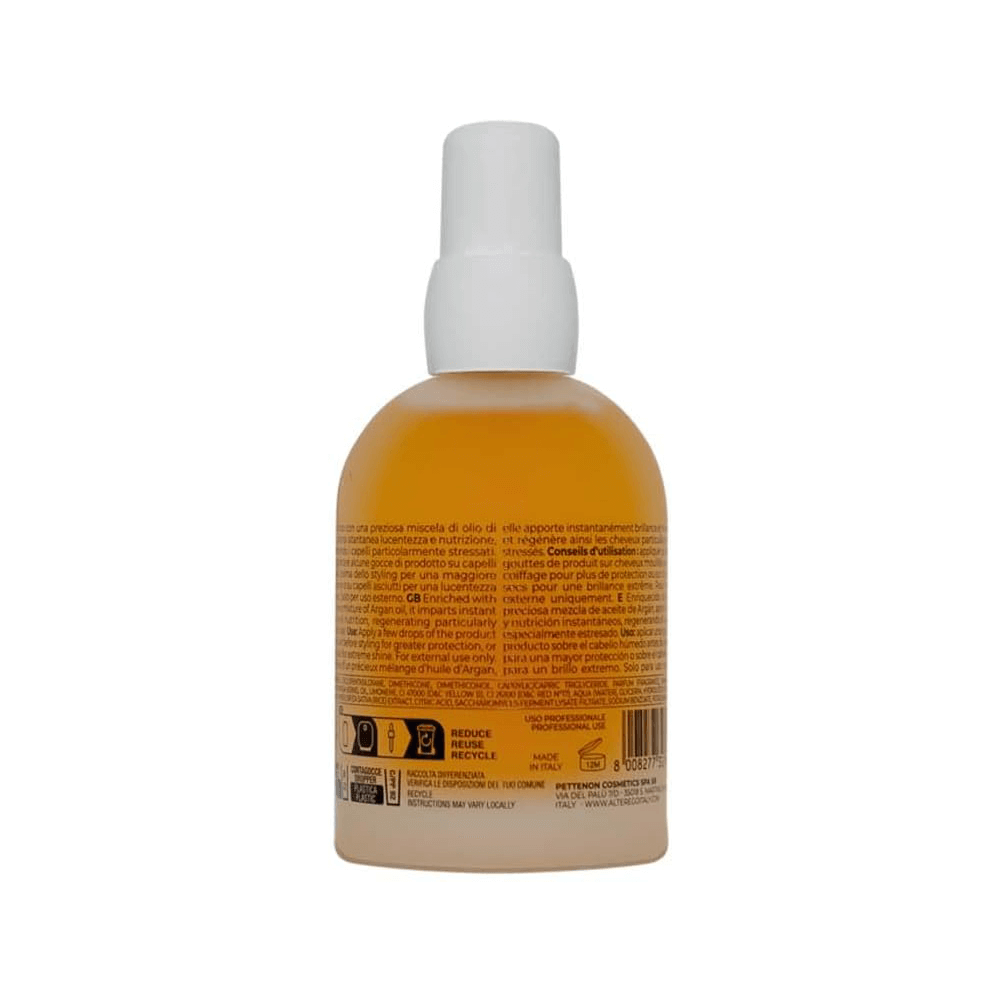 Back view of Silk Oil Blend Hair Conditioning Oil bottle with ingredients list visible, ideal for controlling frizz and adding shine.