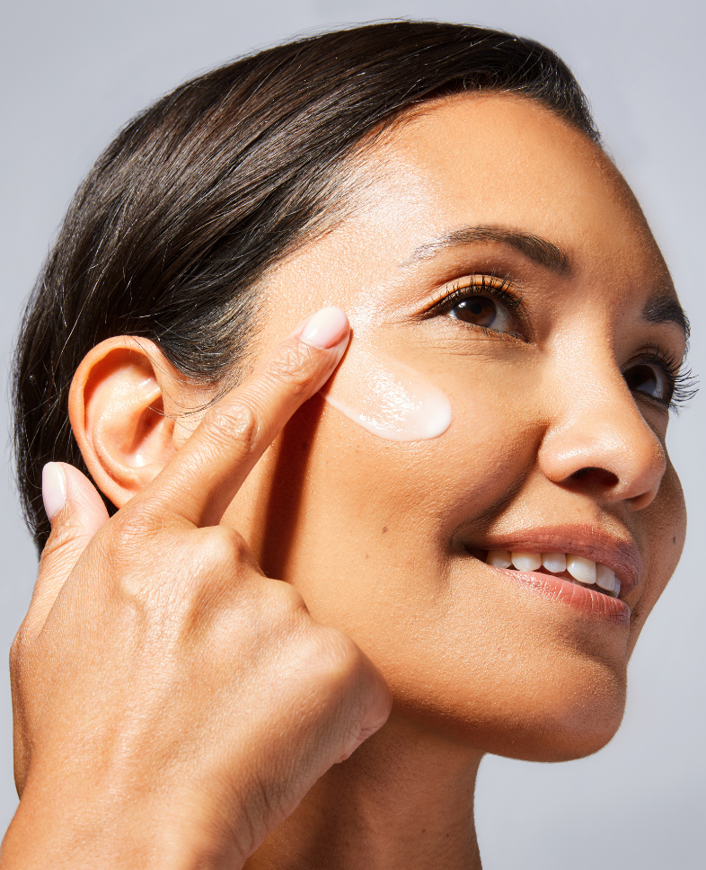 Woman applying Vivier Illuminating Enzymatic Peel™ for smoother, brighter skin; suitable for all skin types.