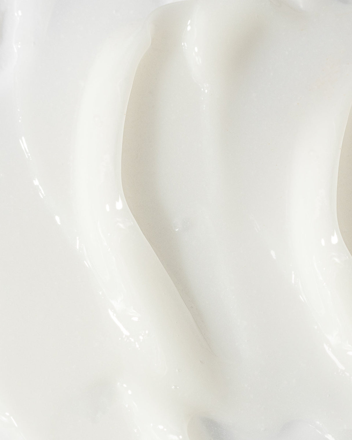 Close-up image of creamy white acne treatment lotion texture, highlighting its smooth and lightweight formulation for clear skin.