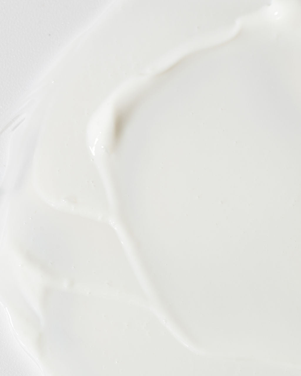 Close-up of Vivier Age-Defying Body Lotion texture, showcasing its creamy consistency and hydrating qualities.