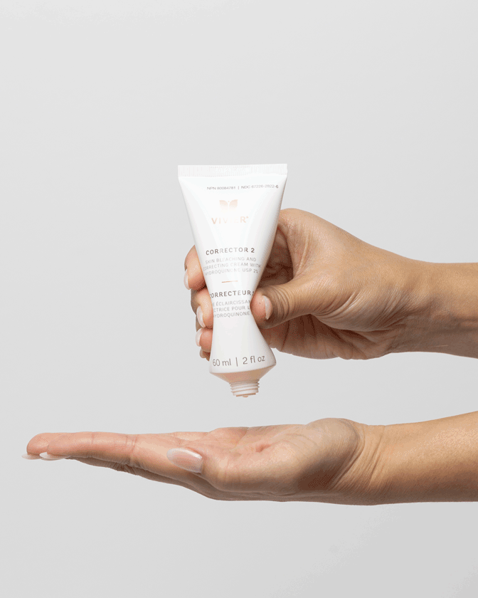 Person applying Vivier Corrector 2 cream for dark spots and uneven skin tone treatment.