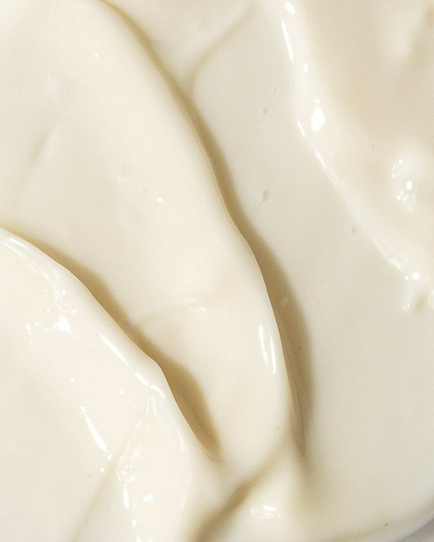 Close-up texture of GrenzCine Eye cream with polyamine growth factors and vitamin C for firmer, hydrated eye skin.