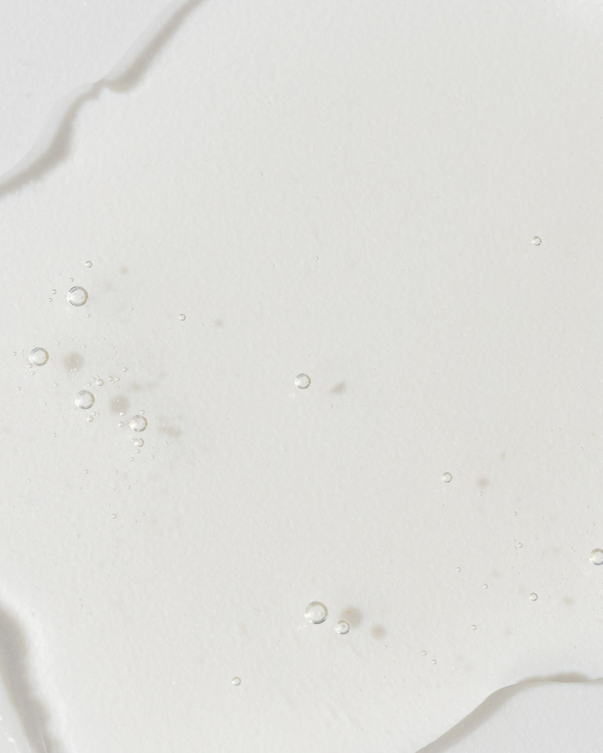 Close-up of GrenzCine Serum texture showcasing its lightweight and hydrating formula.