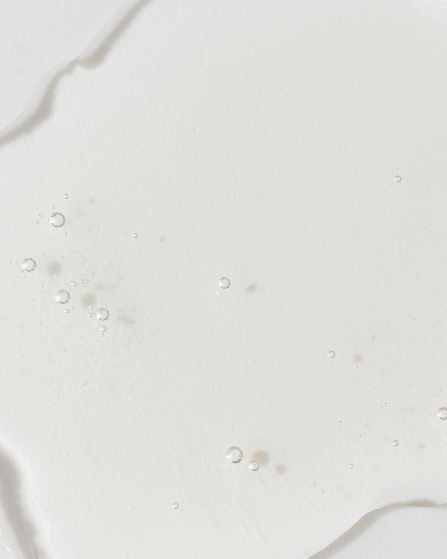 Close-up of GrenzCine Serum texture showcasing its lightweight and hydrating formula.