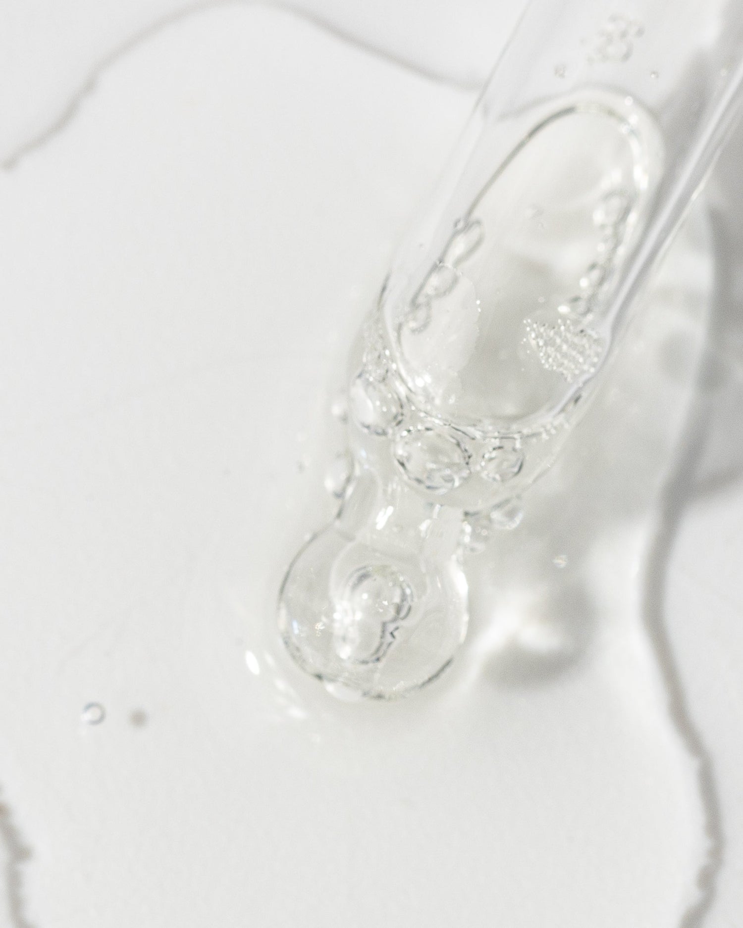 Close-up of Vivier Kine-C serum with Vitamin C and peptides, showcasing its lightweight, oil-free, and hydrating formula.