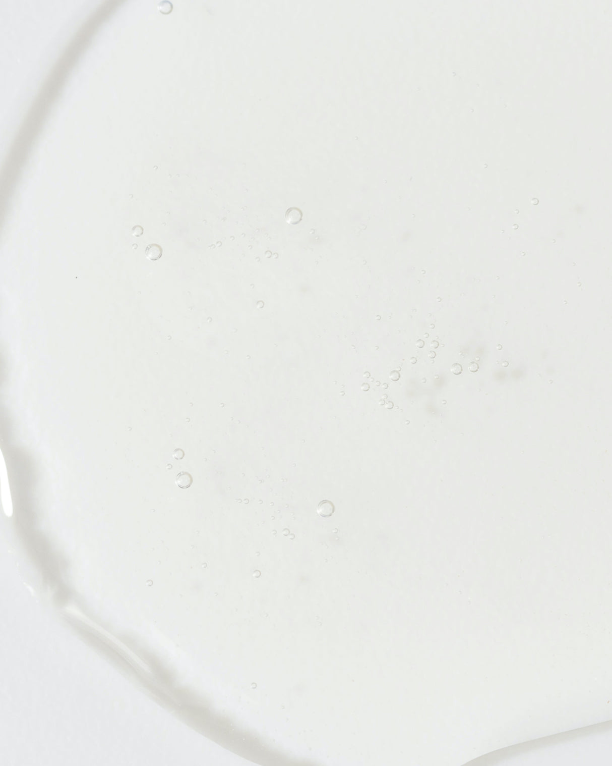 Close-up of clear Vivier QuintiSerum™ texture with visible bubbles, highlighting its antioxidant-rich serum formulation.