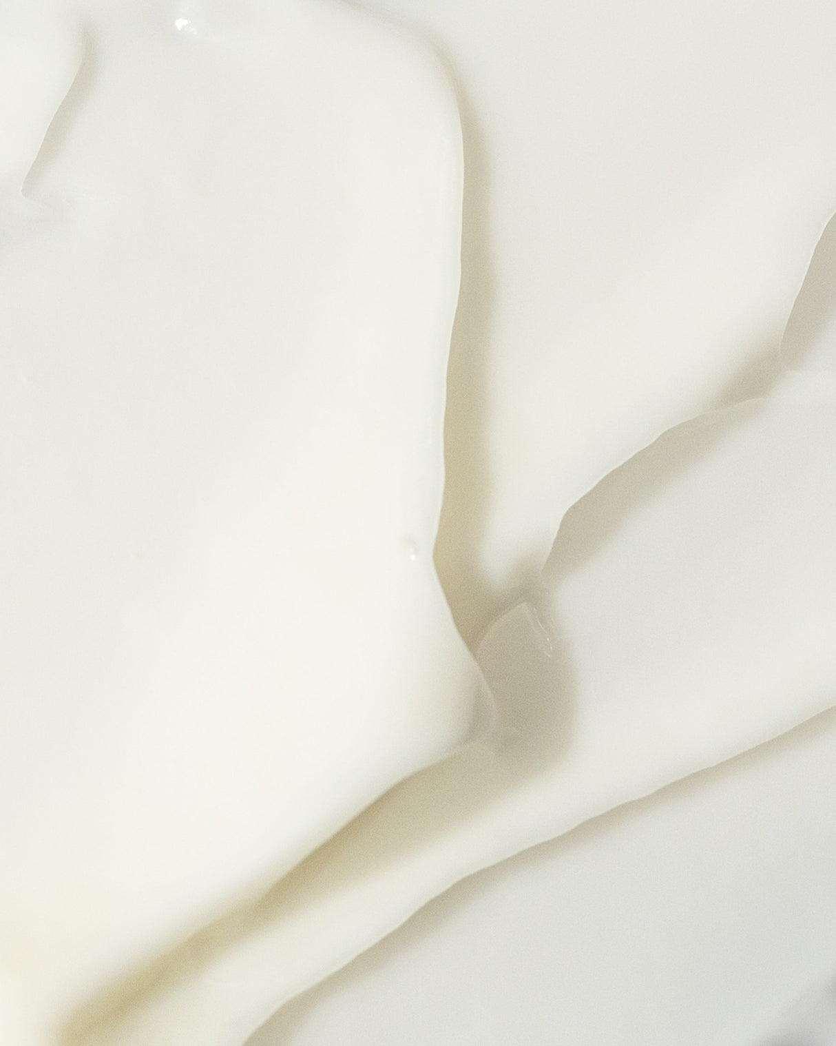 Close-up texture of radiant eye contour cream with hydrating and nourishing ingredients for all skin types.