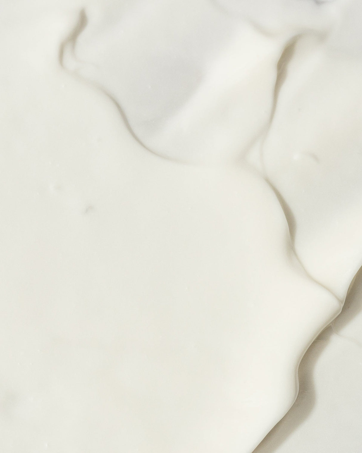 Texture of a creamy Ultra Hydrating Mask infused with Vitamin E, Sweet Almond Extract, and Shea Butter for optimal skin hydration.