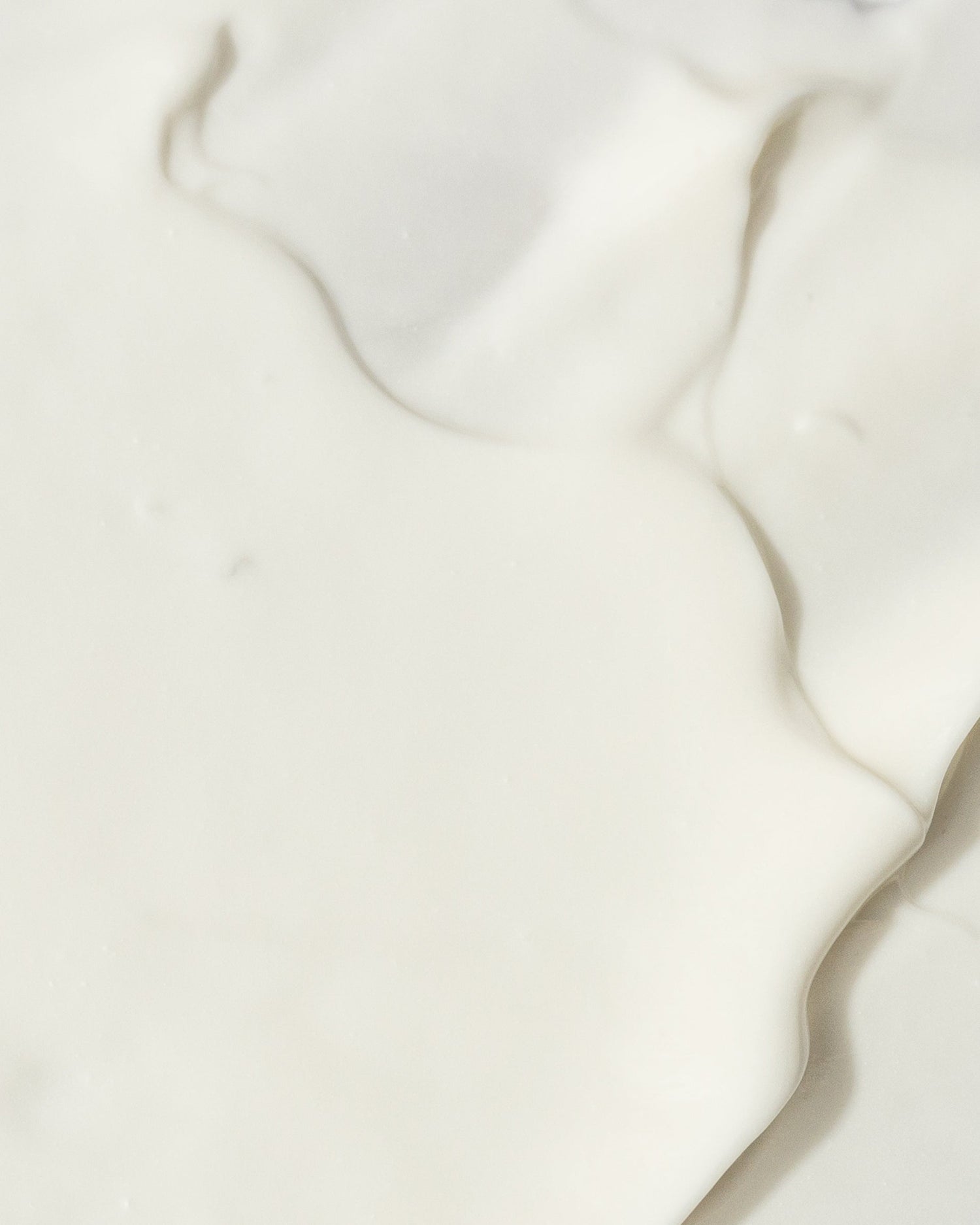 Texture of a creamy Ultra Hydrating Mask infused with Vitamin E, Sweet Almond Extract, and Shea Butter for optimal skin hydration.