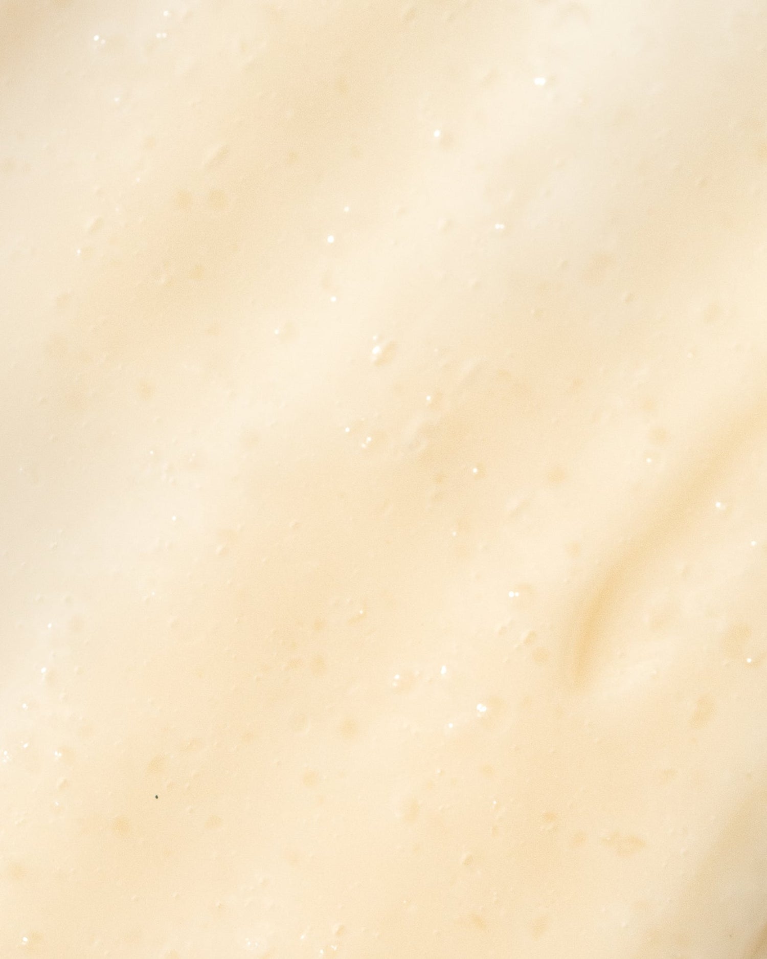Close-up texture of Vivier Vitamin C Scrub with brightening and hydrating properties for soft, radiant skin.