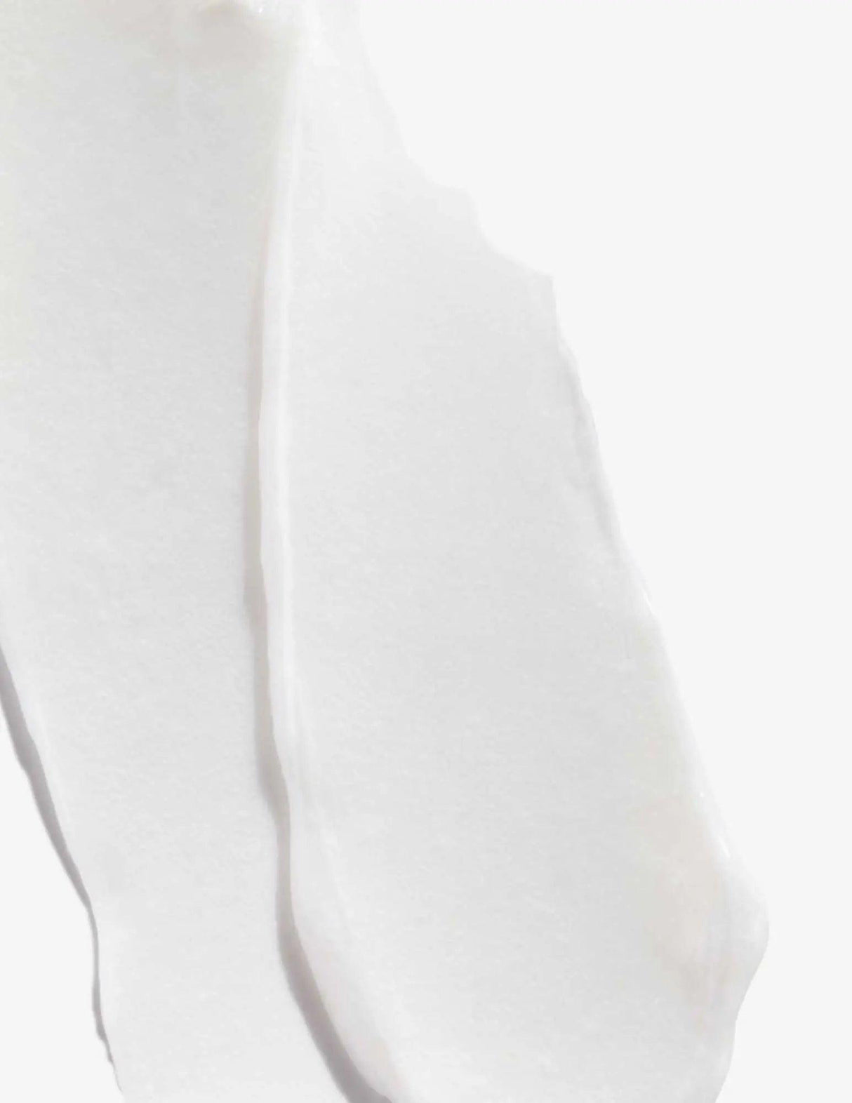 Texture of Redken Acidic Bonding Concentrate Conditioner, showing creamy white hair product consistency for damaged hair repair.