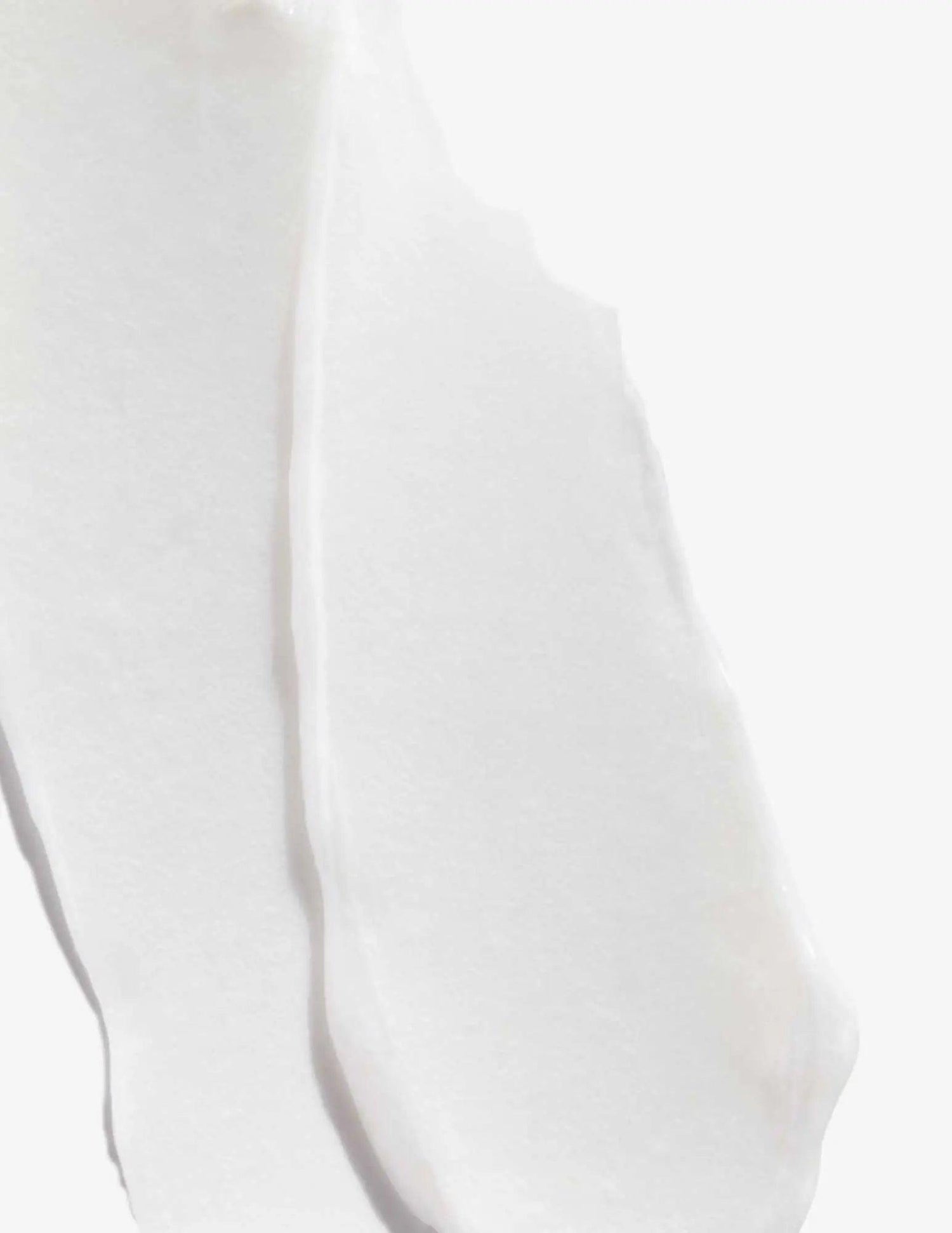 Texture of Redken Acidic Bonding Concentrate Conditioner, showing creamy white hair product consistency for damaged hair repair.