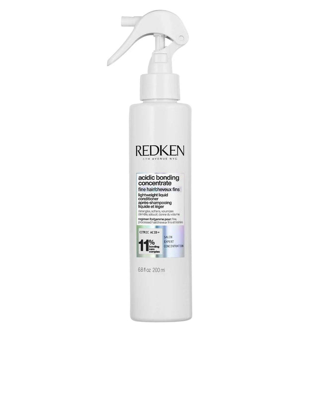 Redken Acidic Bonding Concentrate Lightweight Liquid Conditioner bottle for strengthening and protecting all hair types.
