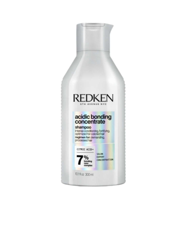 Redken Acidic Bonding Concentrate Shampoo bottle for damaged hair repair and strengthening.
