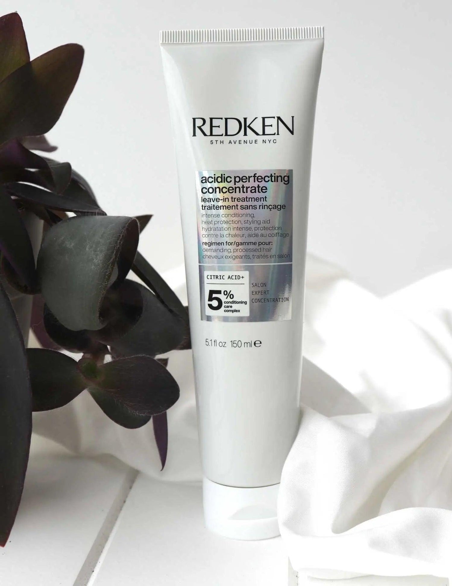 Redken Acidic Perfecting Concentrate Leave-in Treatment tube on white background, hair care for all types and textures.