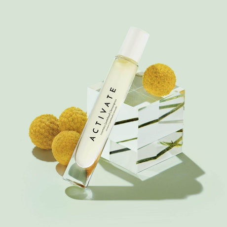 Activate Mood Roller product with a blend of patchouli, lemongrass, rosemary, perfect for energizing mornings and workouts.