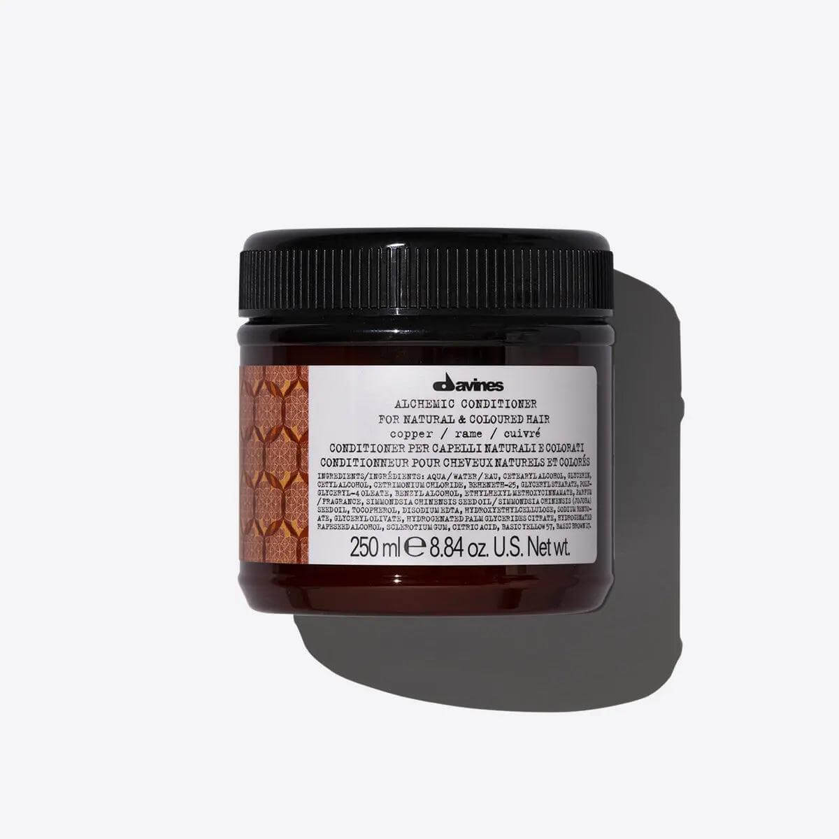 Davines Alchemic Conditioner Copper for enhancing warm red shades, 250ml jar with label, against a white background.