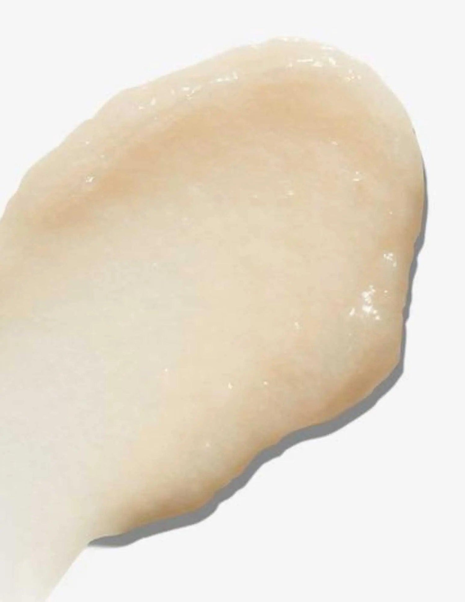 Creamy texture of Redken All Soft Mega Curls Conditioner for curly hair hydration and frizz control.