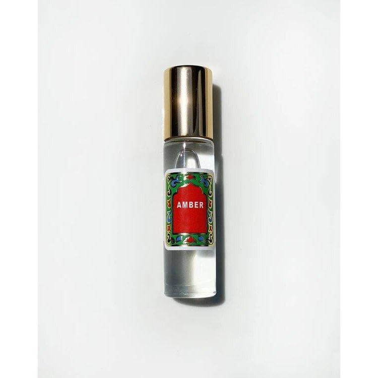 Amber Roll On Perfume by Nemat featuring a delicate, long-lasting amber fragrance, harmonizing with body chemistry for a fresh scent.