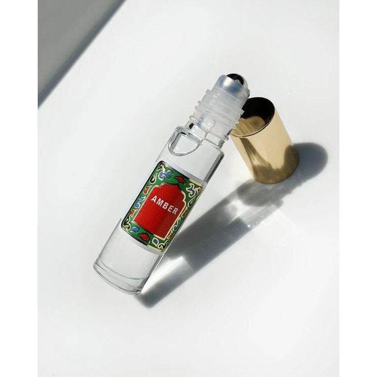 Amber Roll On Perfume by Nemat with delicate aroma and personalized scent in a clear bottle, featuring soft and clean fragrance notes.