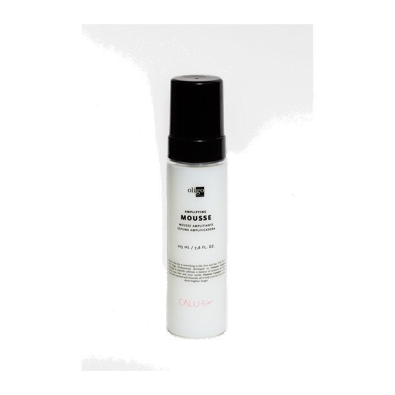 Amplifying Mousse for natural volume and flexible hold with heat protection in a sleek black and white bottle.