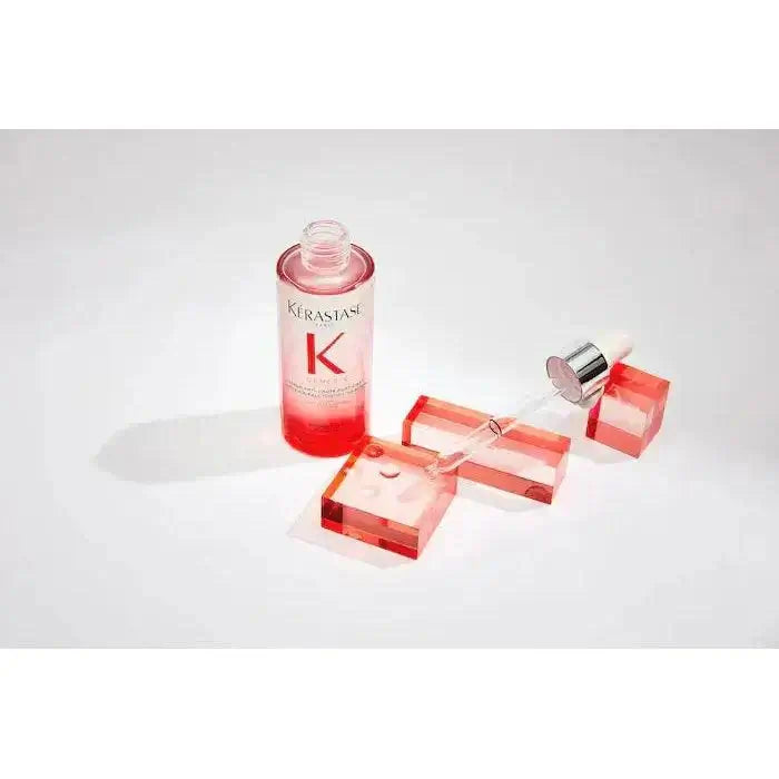 Kérastase Anti-Breakage Fortifying Serum for damaged hair in a pink bottle with applicator, designed to strengthen and protect.