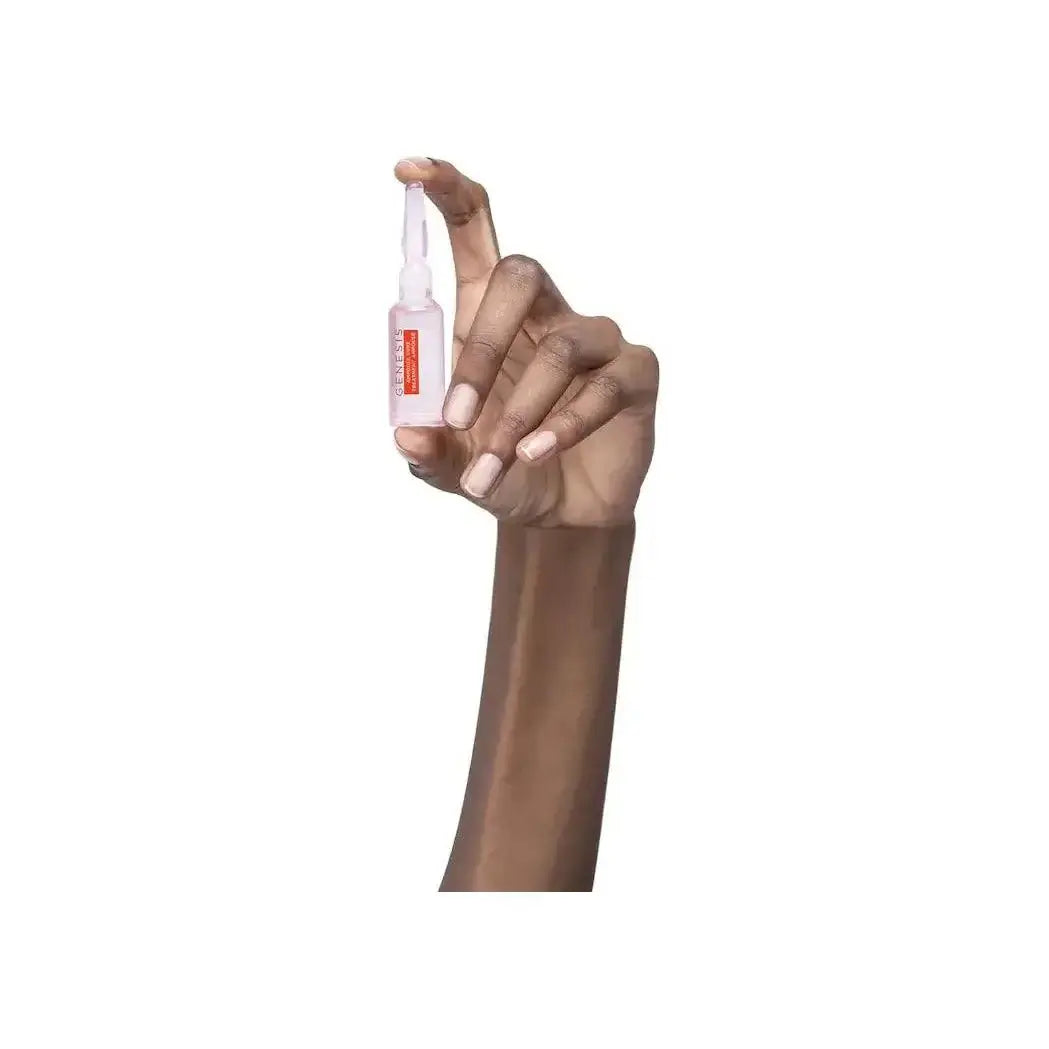 Hand holding Kerastase Anti-Breakage Fortifying Treatment Ampoule for hair strengthening.